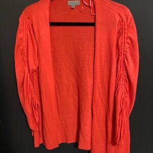 Buttonless cardigan worn great vibrant orange tone